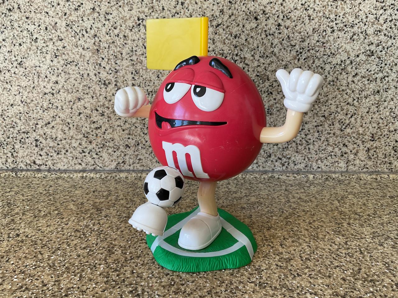 M&M snoepdispencer.      Klein.