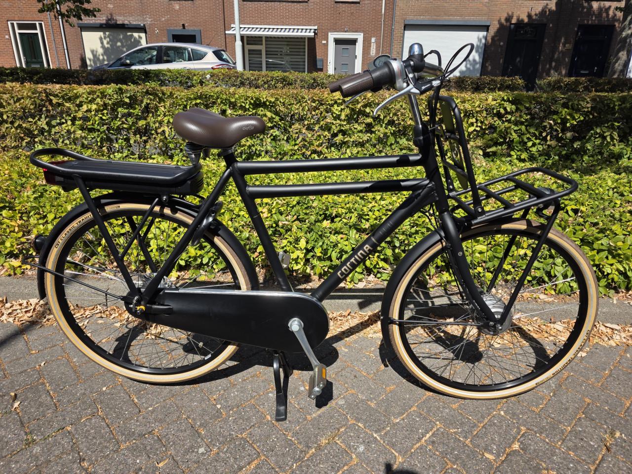 Zo goed als nieuwe Cortina elektrische heren fiets