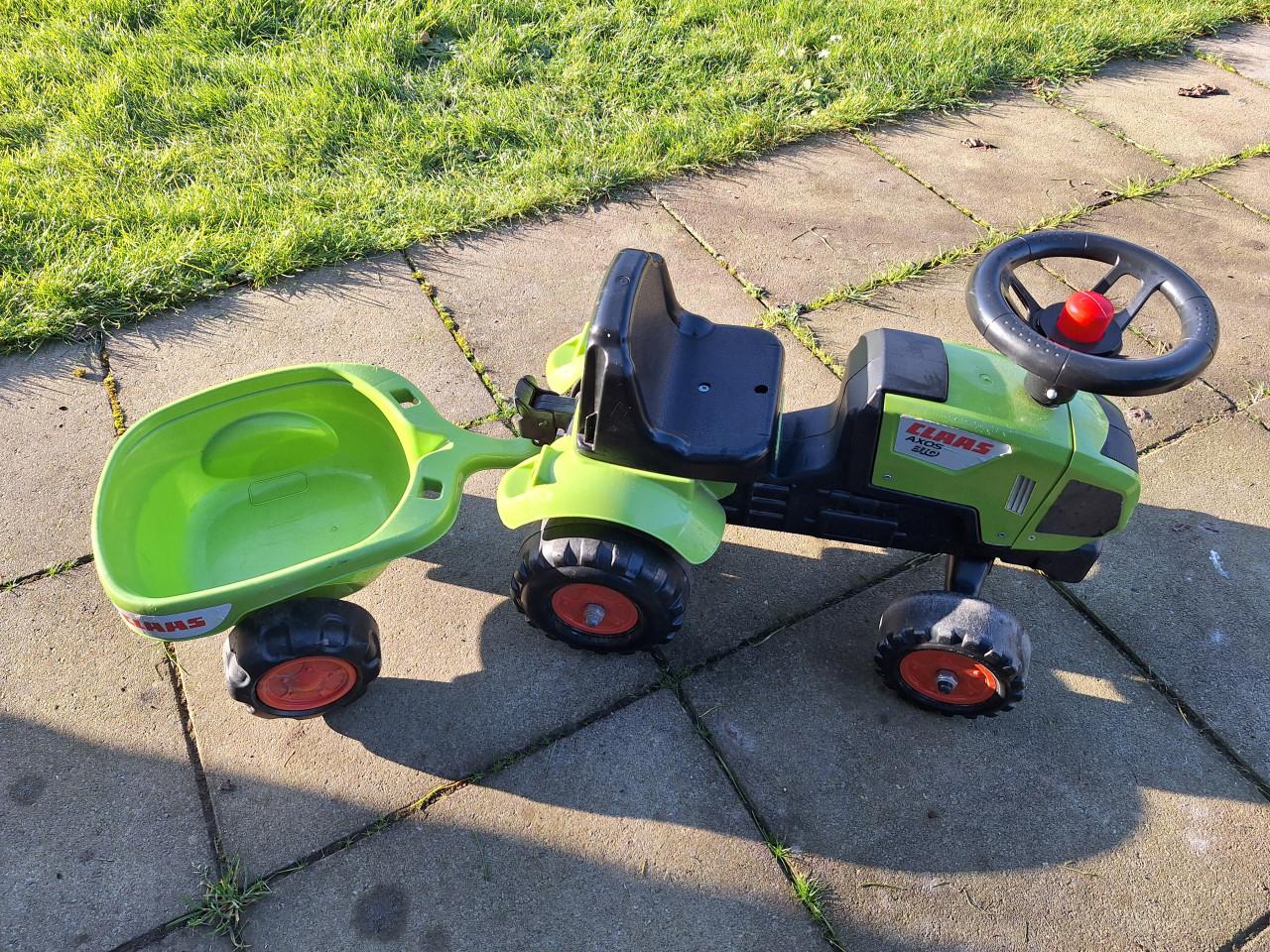 Claas looptractor met aanhanger