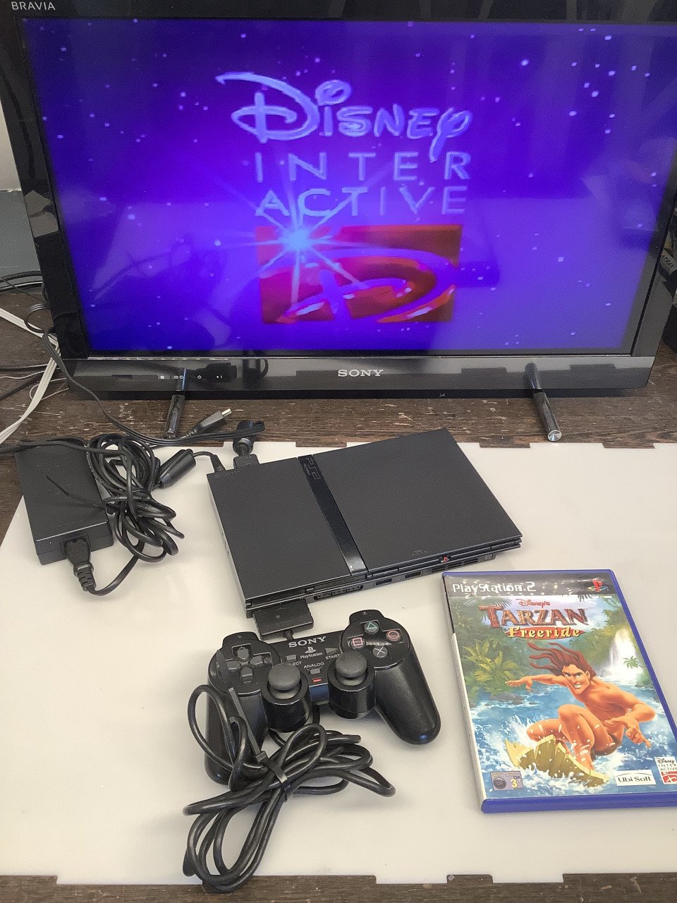 PlayStation 2 slim ( PS2 ) zwart. Met voeding en AV kabel. Met 1 controller