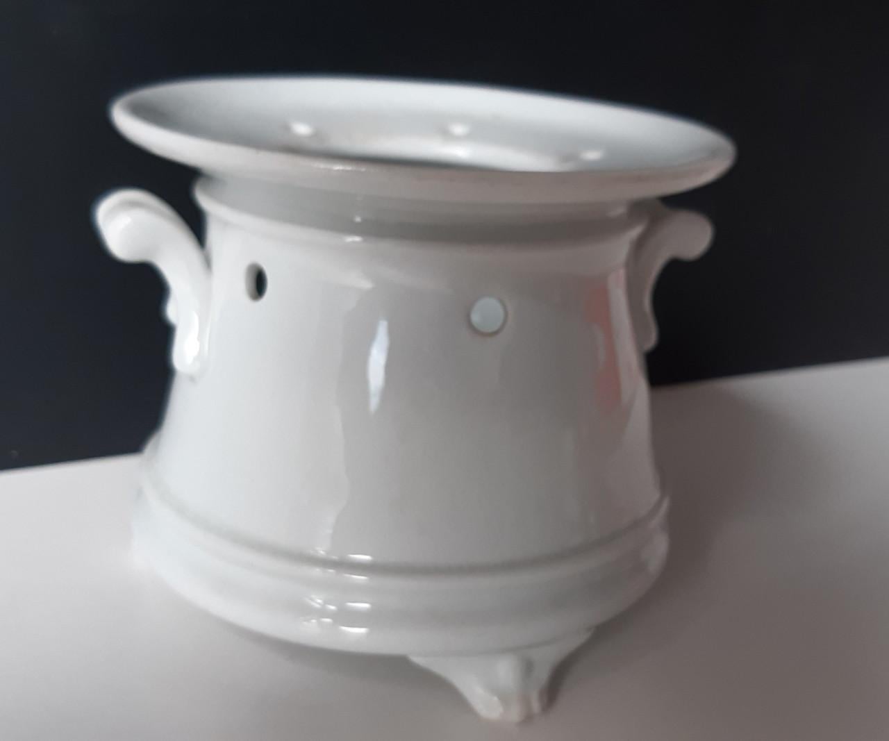 Petrus Regout wit theelicht op pootjes met vetschuitje