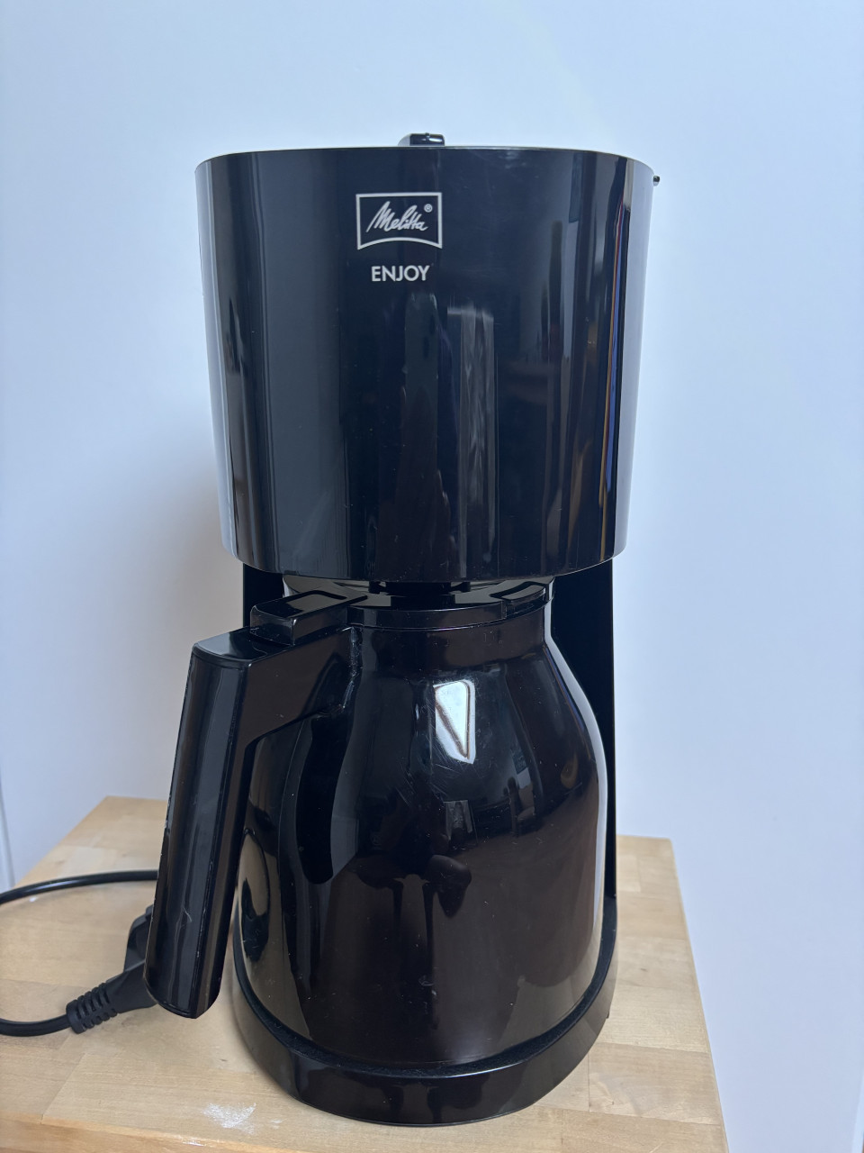 Melitta filter koffiezetapparaat zwart met thermoskan.