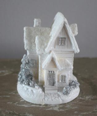 Wit kersthuisje et licht