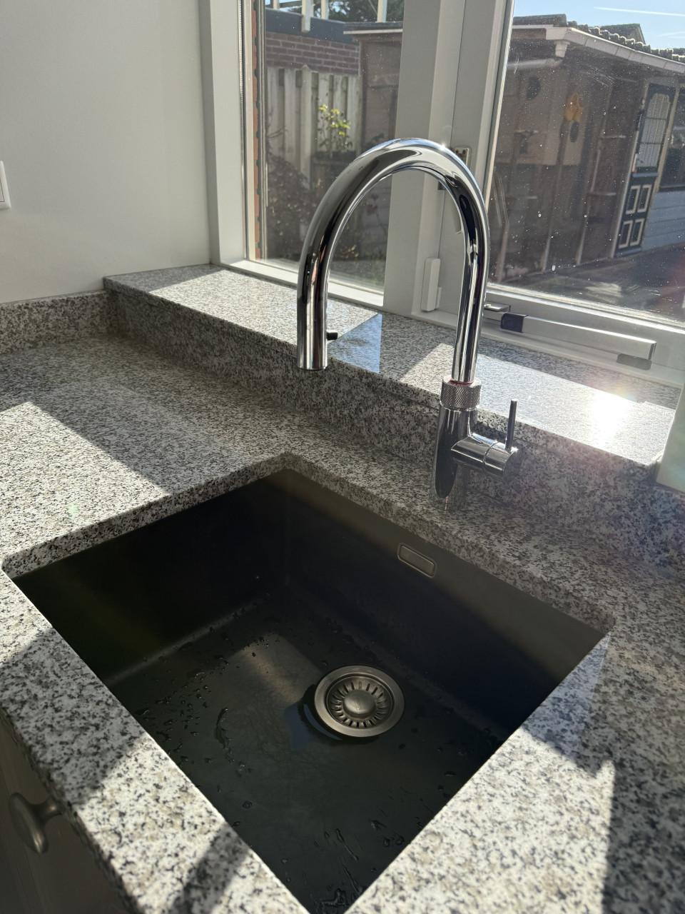 Complete hoekkeuken met Quooker, Siemens en Atag apparatuur