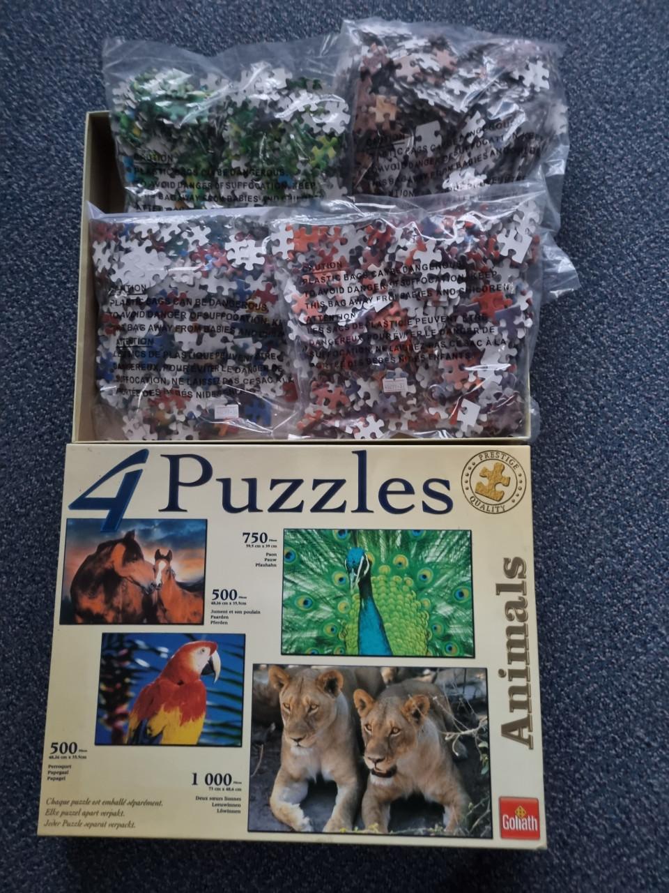 4 puzzels in een doos