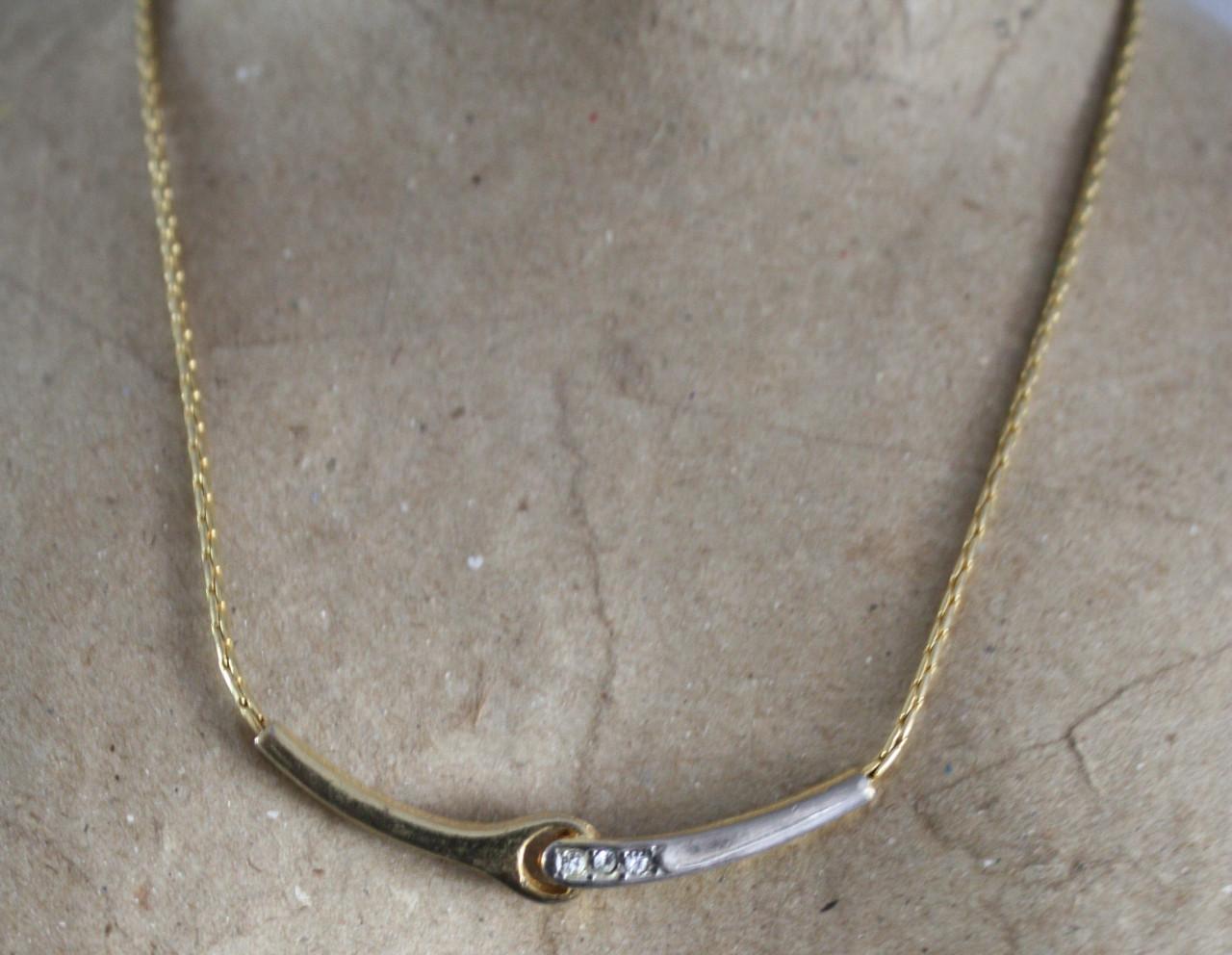 Goudkleurige ketting met zilverkleur  stukje