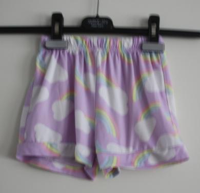 Paars broekje met bloemen print maat 110-116