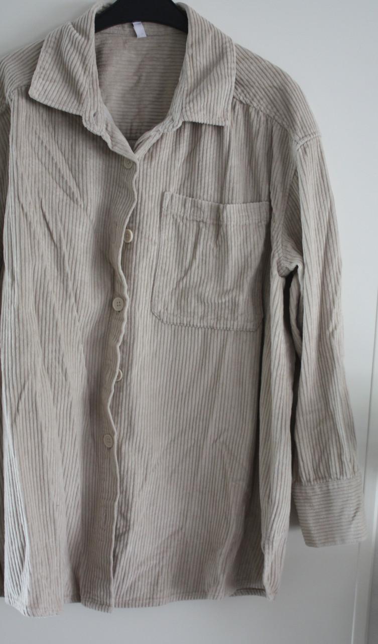 Beige blouse met ribbel  maat L
