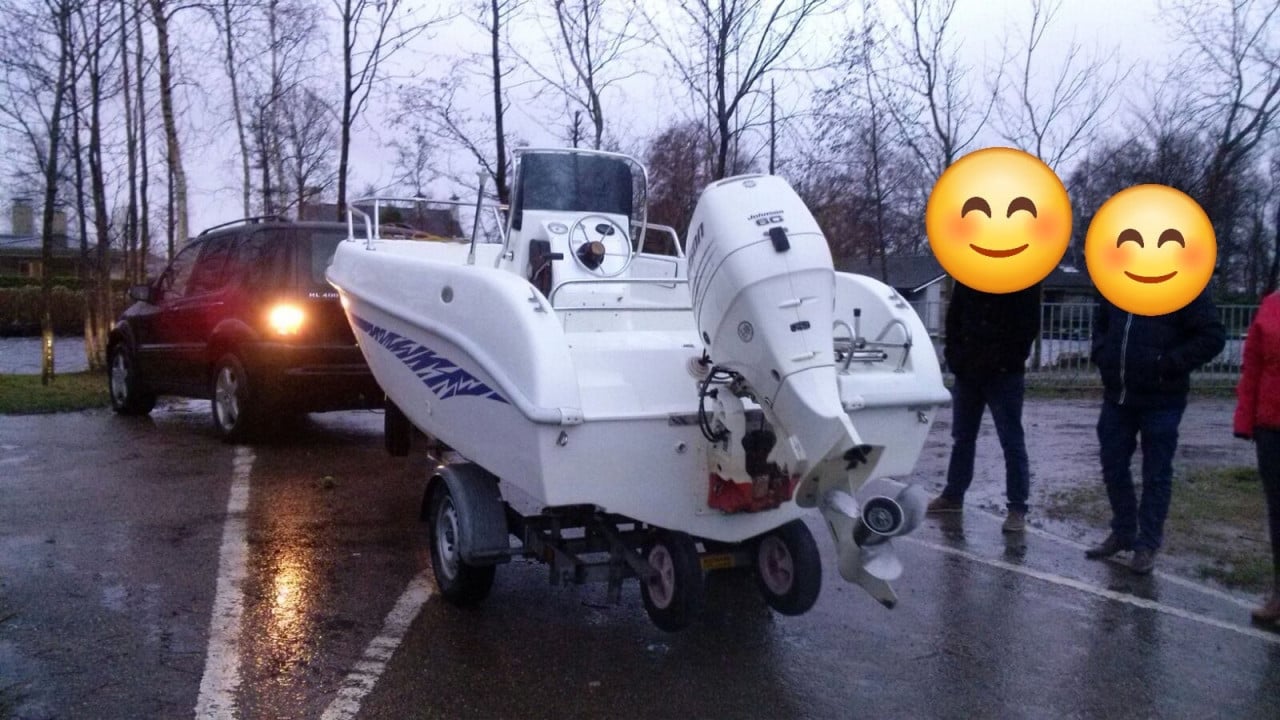 Consoleboot met 60 pk buitenboordmotor en trailer