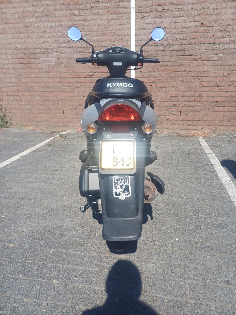Grijze kymco scooter te koop