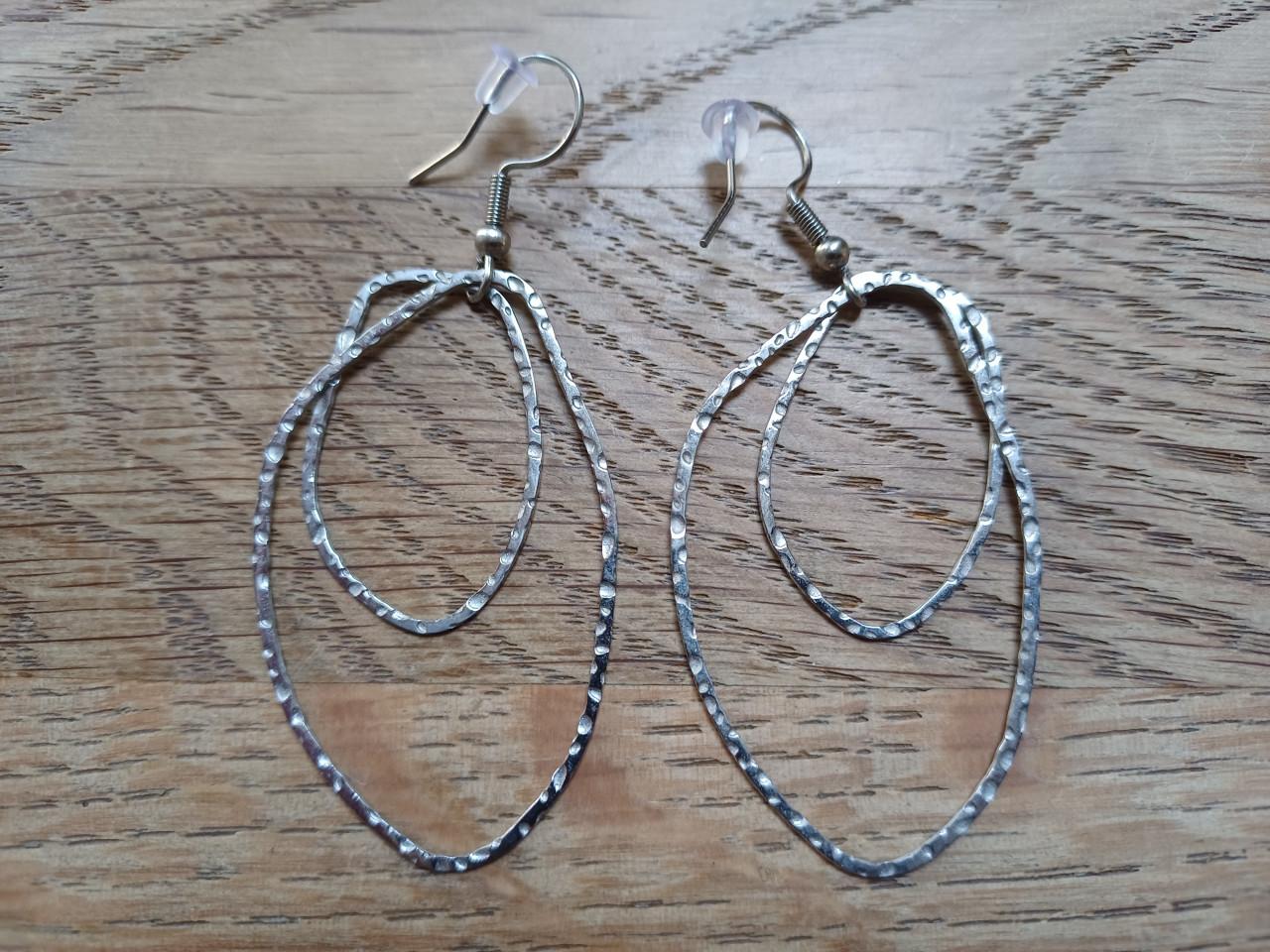 Leuke zilverkleurige oorbellen/hangers van Zusss