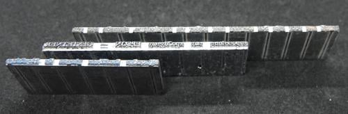 Curiosa metalen zetblokken uit drukkerij met div. teksten