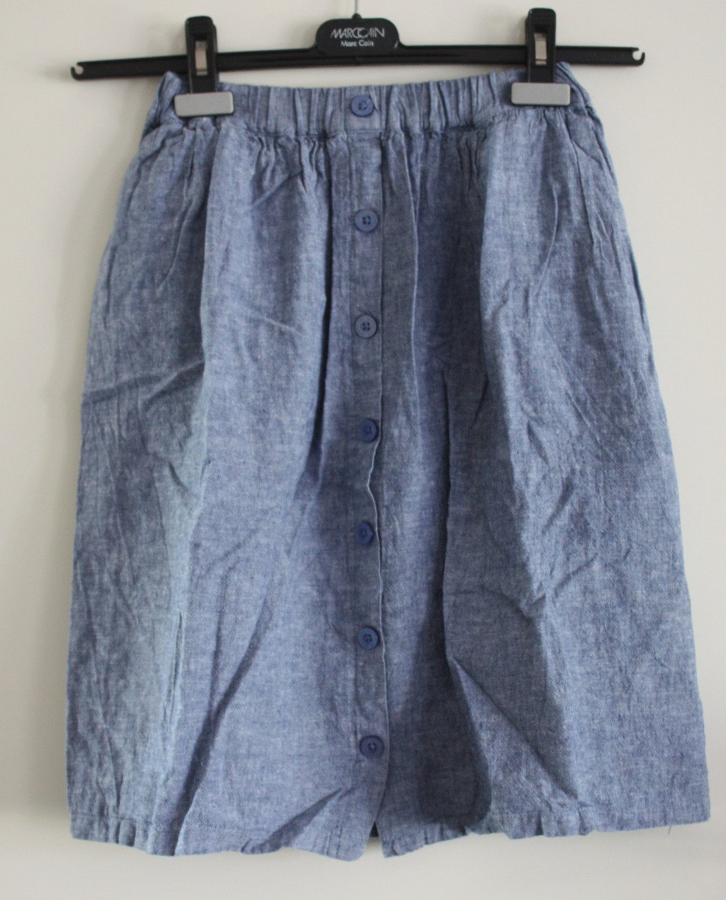 Blauwe rok met knopen maat 140