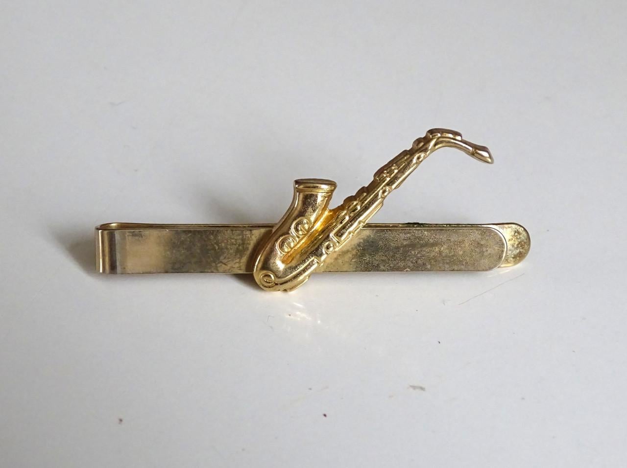 Saxofoon speldjes en manchetknoop