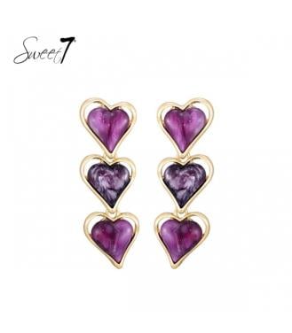 Paarse oorhangers met 3 harten en een goudkleurige omlijsting