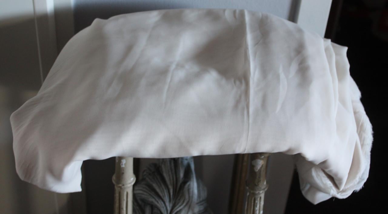 Grote lap voetingstof gladde stof creme kleur