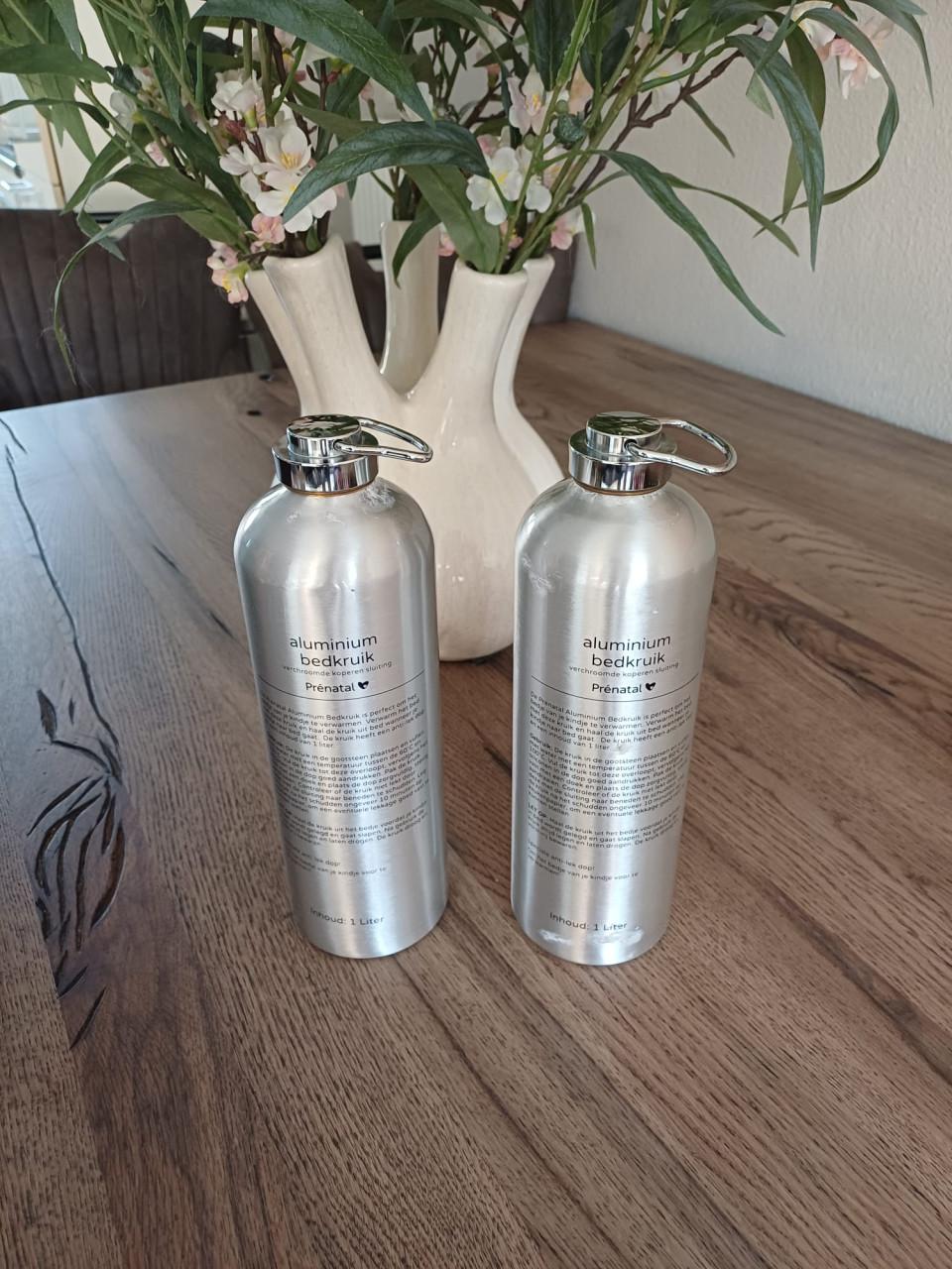 Prénatal aluminium kruik 2x + 2x Prénatal kruikenzak — €10