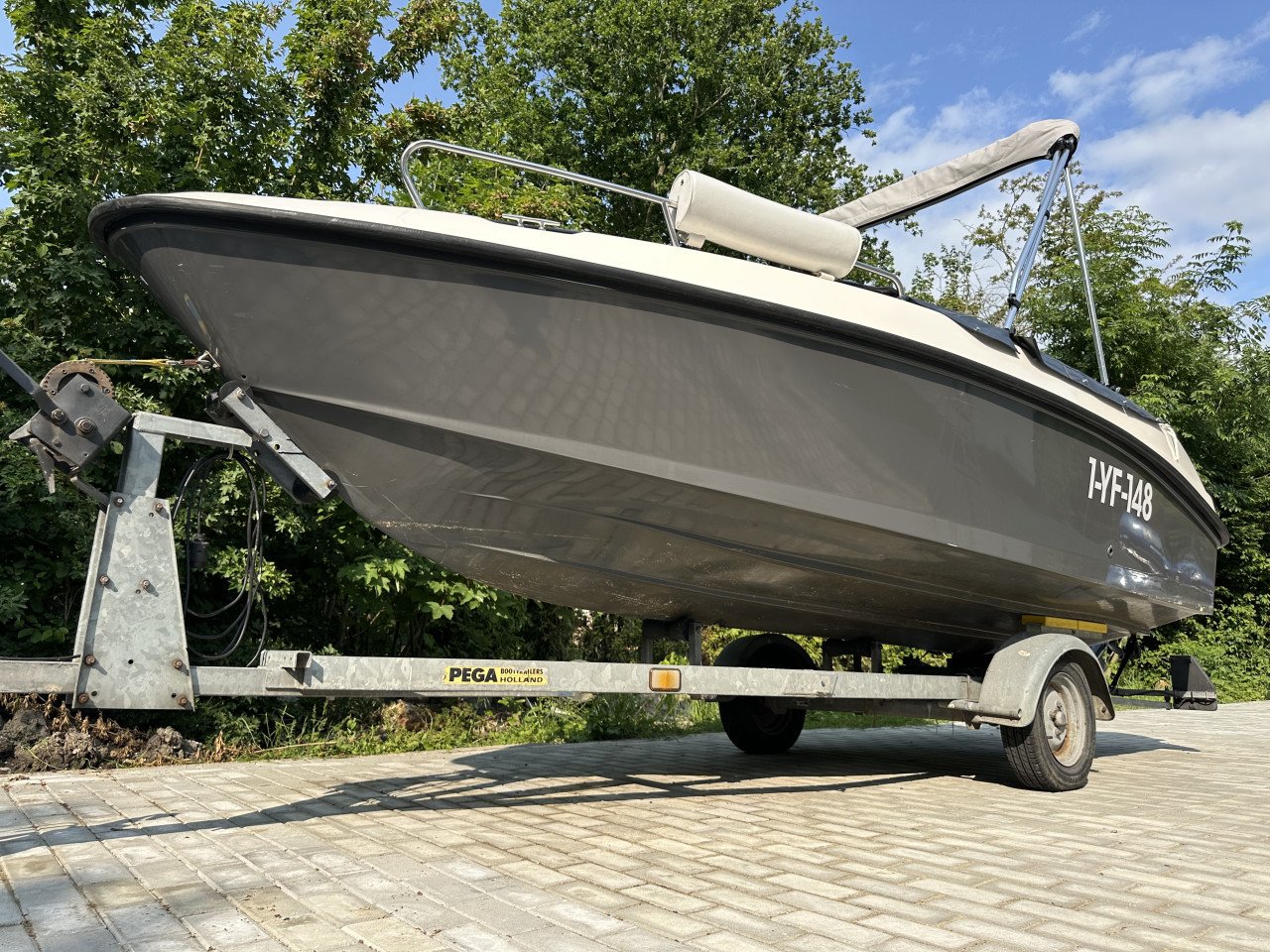 Mooie Elan 15SC met vrijwel nieuwe Mercury 60 pk en Pega trailer