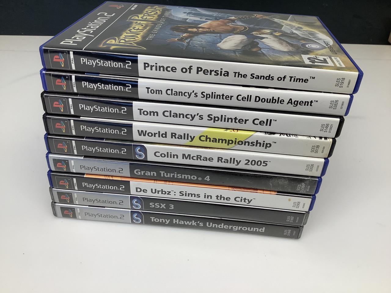 PlayStation 2 zilverkleurig met controller, memory card en spellen.