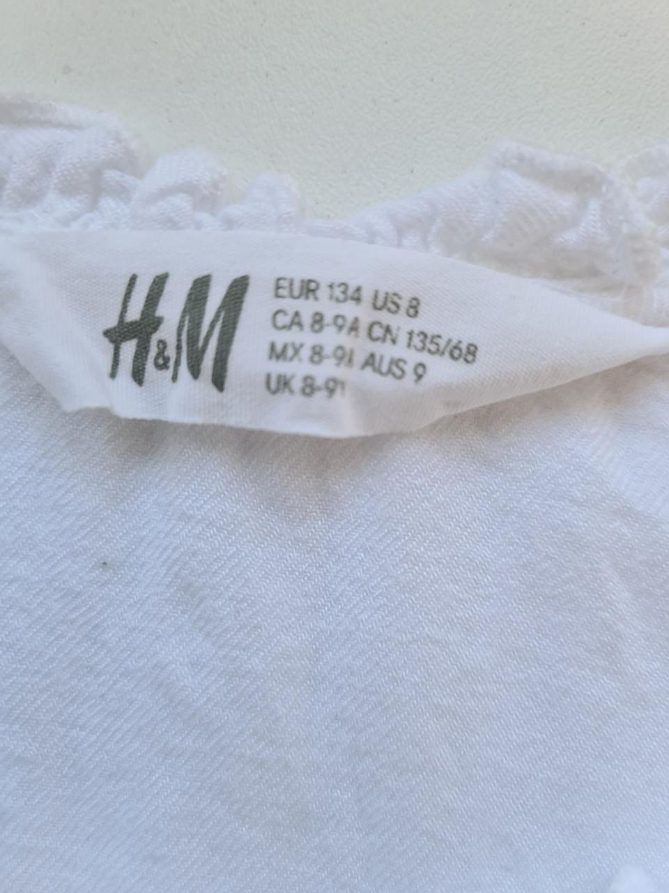 Mooi wit blousje met roezels van H&M Maat 134