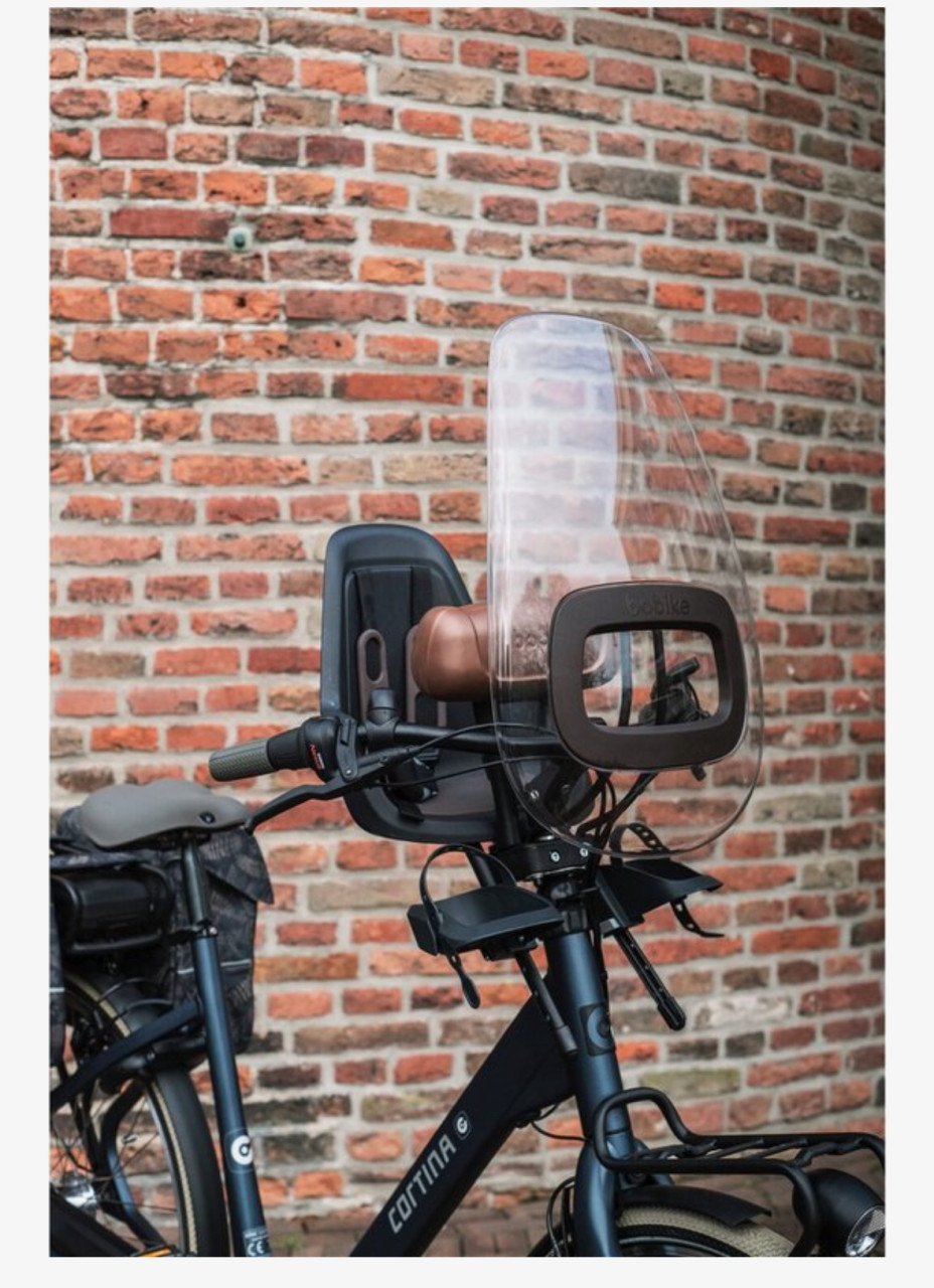 Bobike voorzitje inclusief windscherm, slaaprol en bevestigingsblokje.