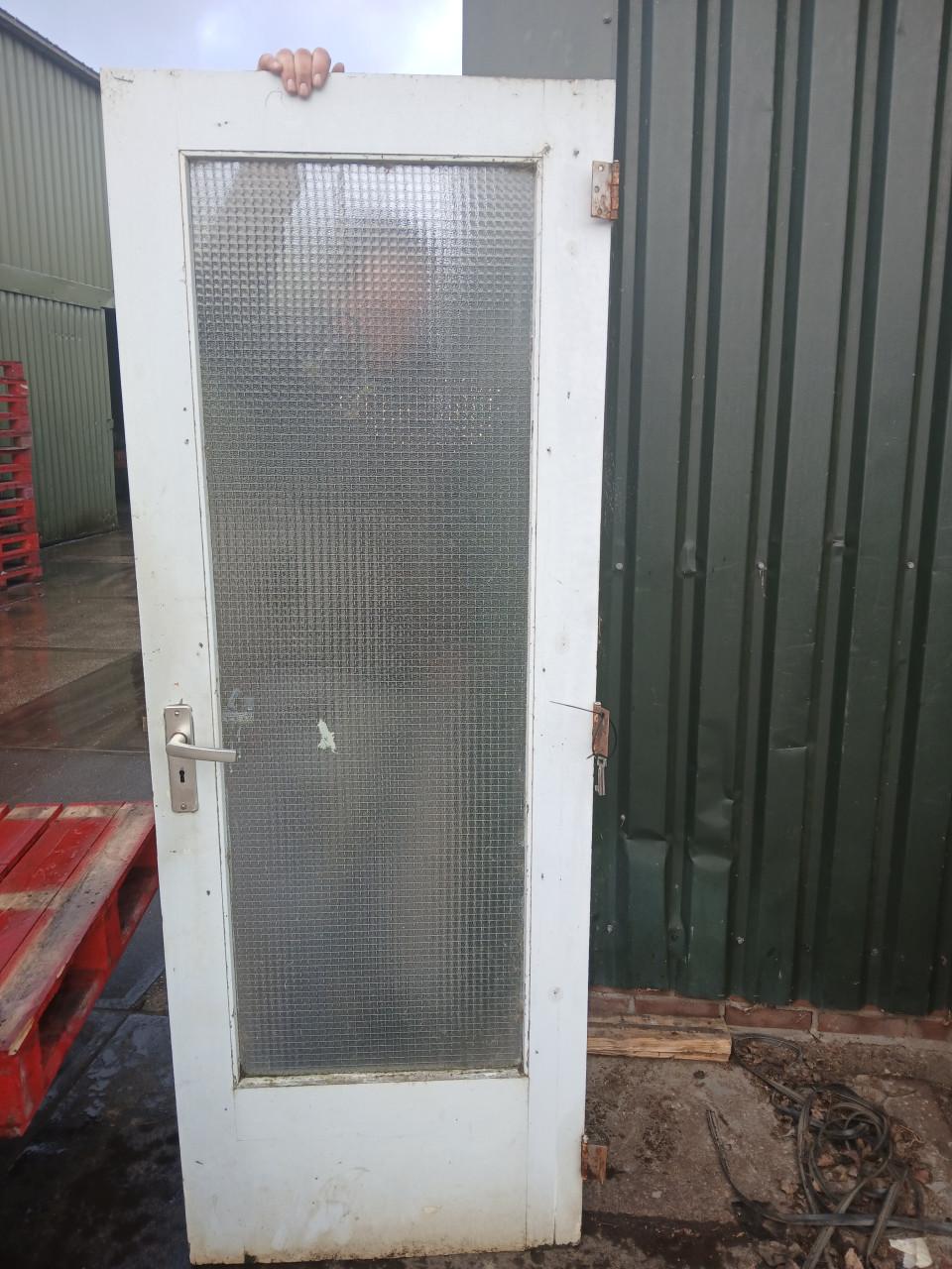 Te koop merbau buitendeur met draadglas