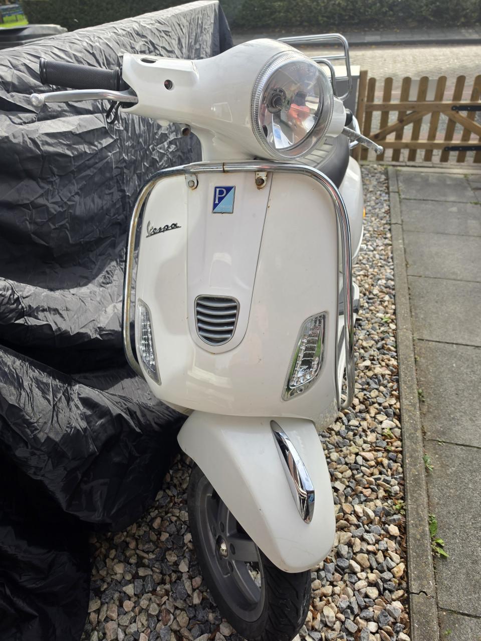 Vespa LX50 blauw kenteken