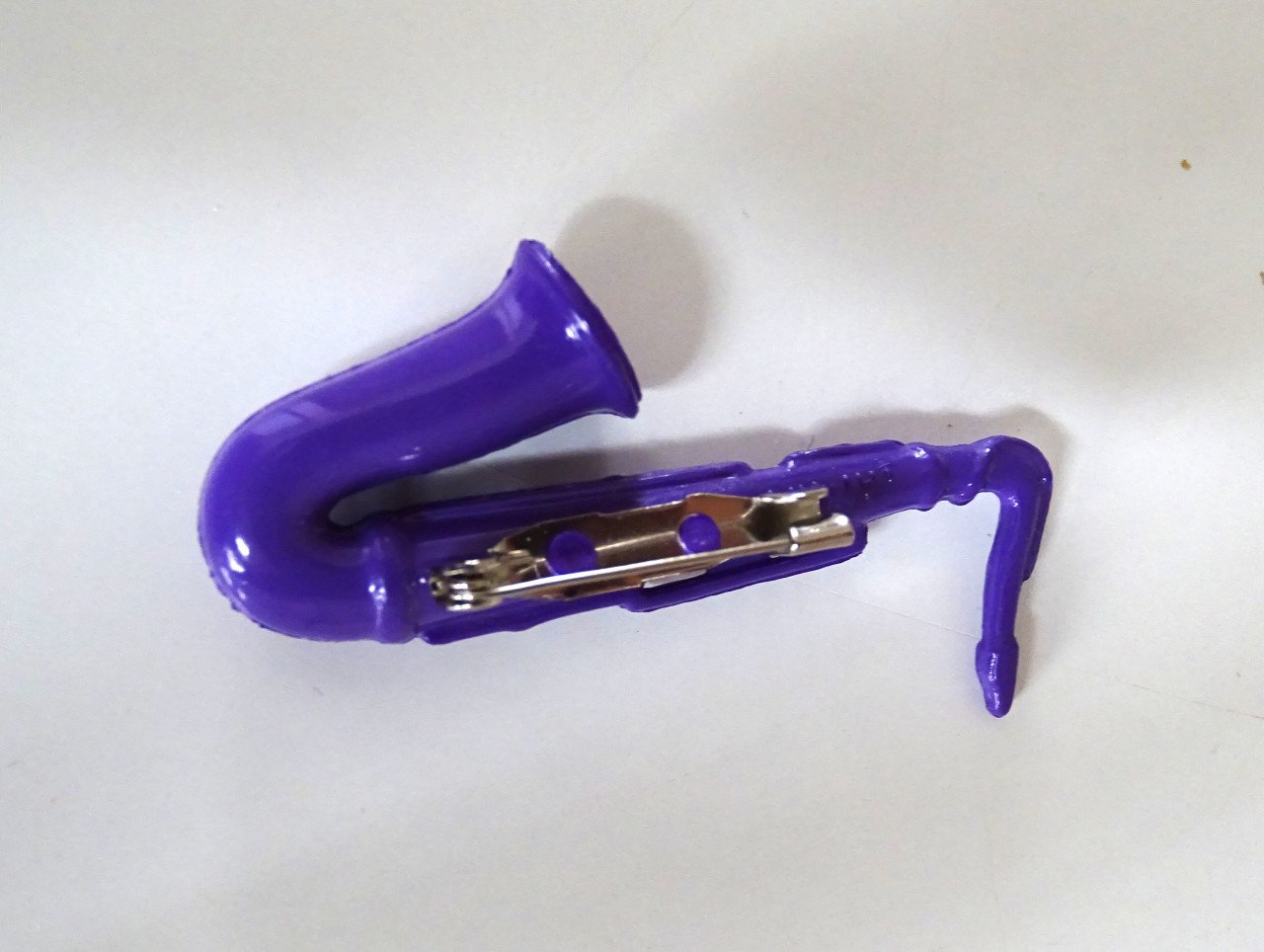 Saxofoon speldjes en manchetknoop