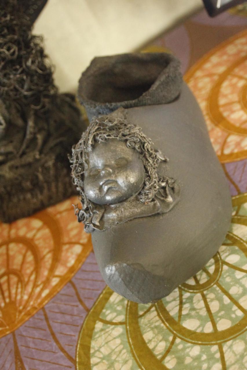 Houten kinder klomp..Met gezichtje