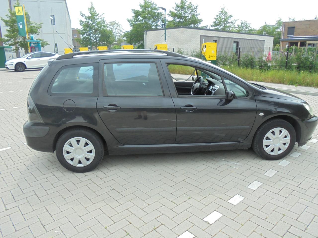 307 1.4 I  - 16V Break uit het bouwjaar 2005 met Apk en N.A.P