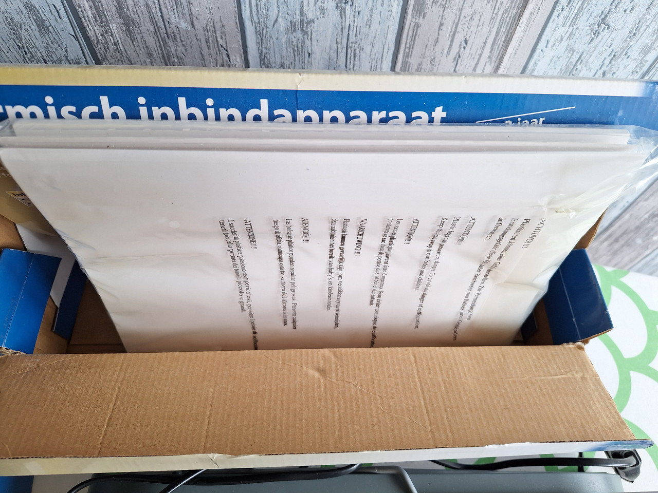 Inbindapparaat met inbindmappen