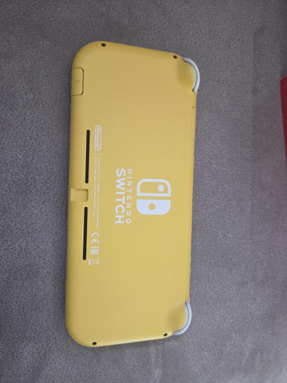 Nintendo Switch Lite grijs en geel evt. incl. spellen
