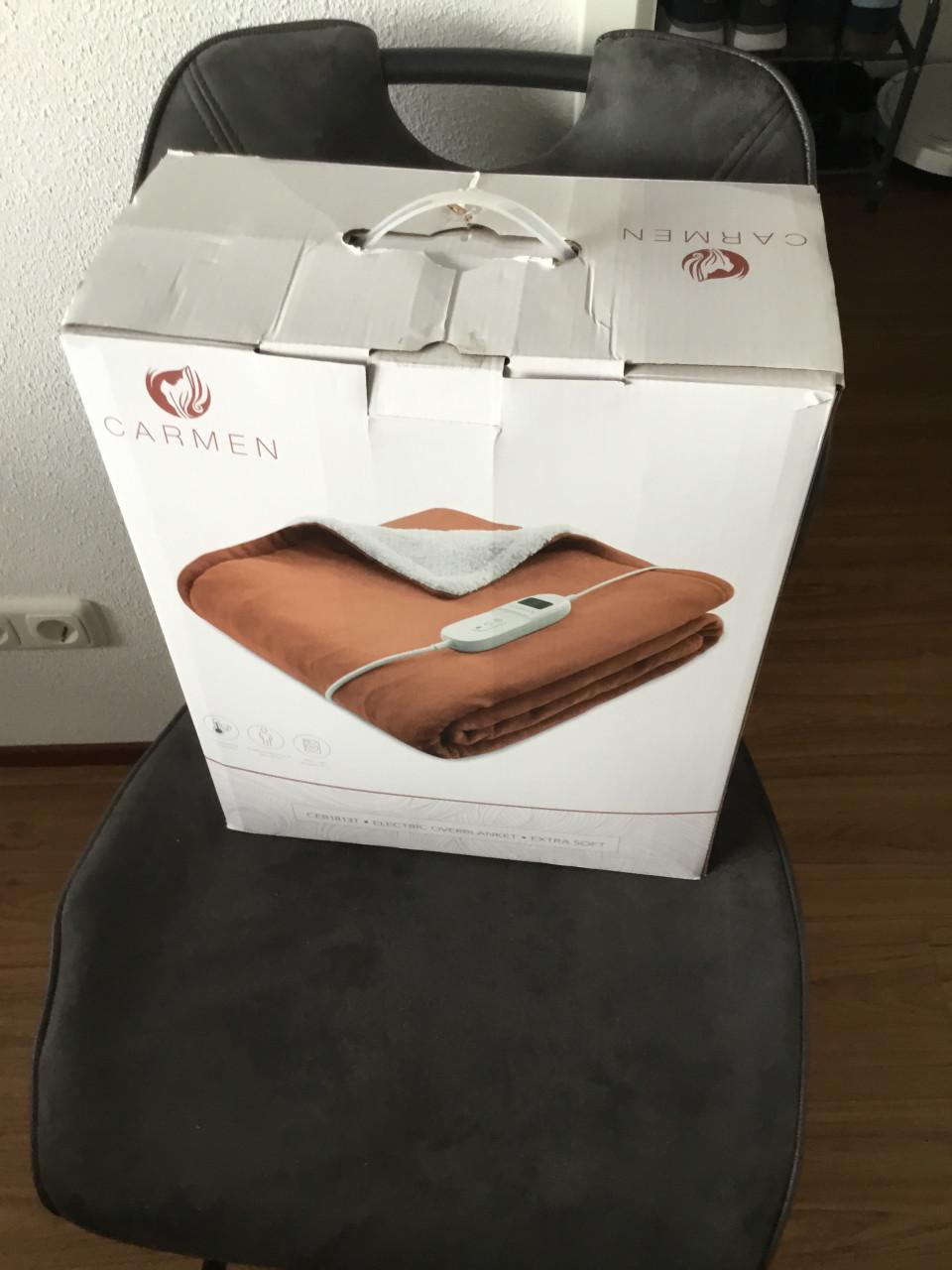 Elektrische warmtedeken en een nek en schouder massage apparaat