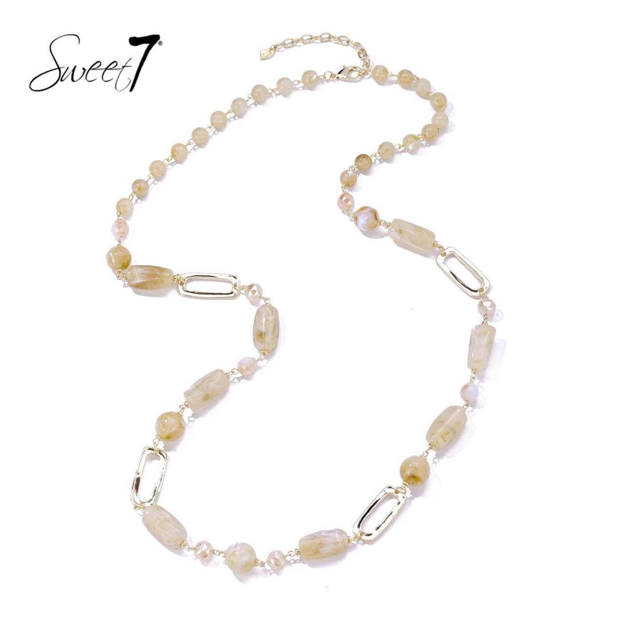 Halsketting met beige kralen en goudkleurige schakels