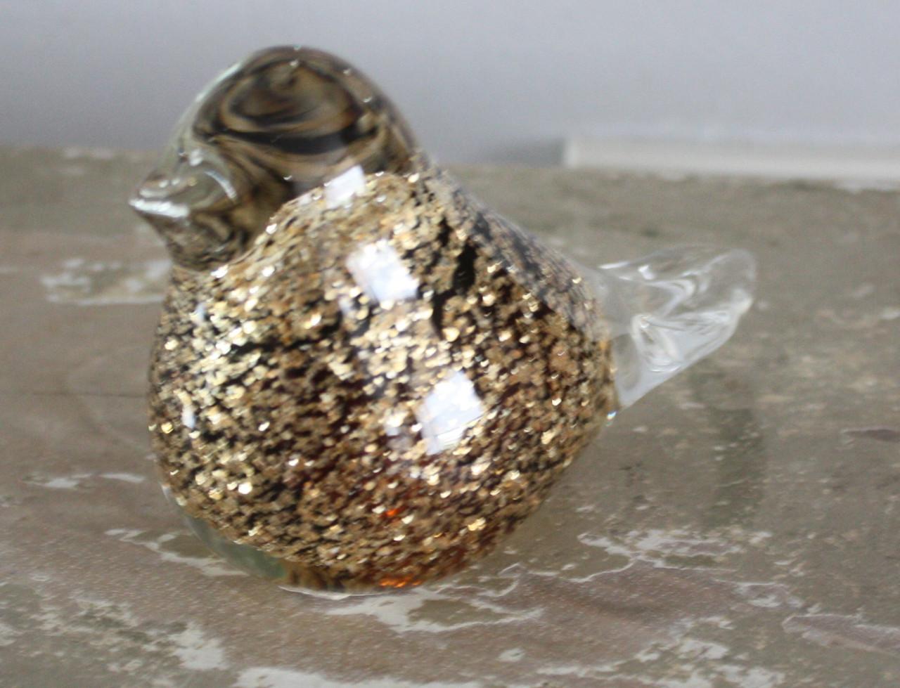 Glazen vogel met goudkleur