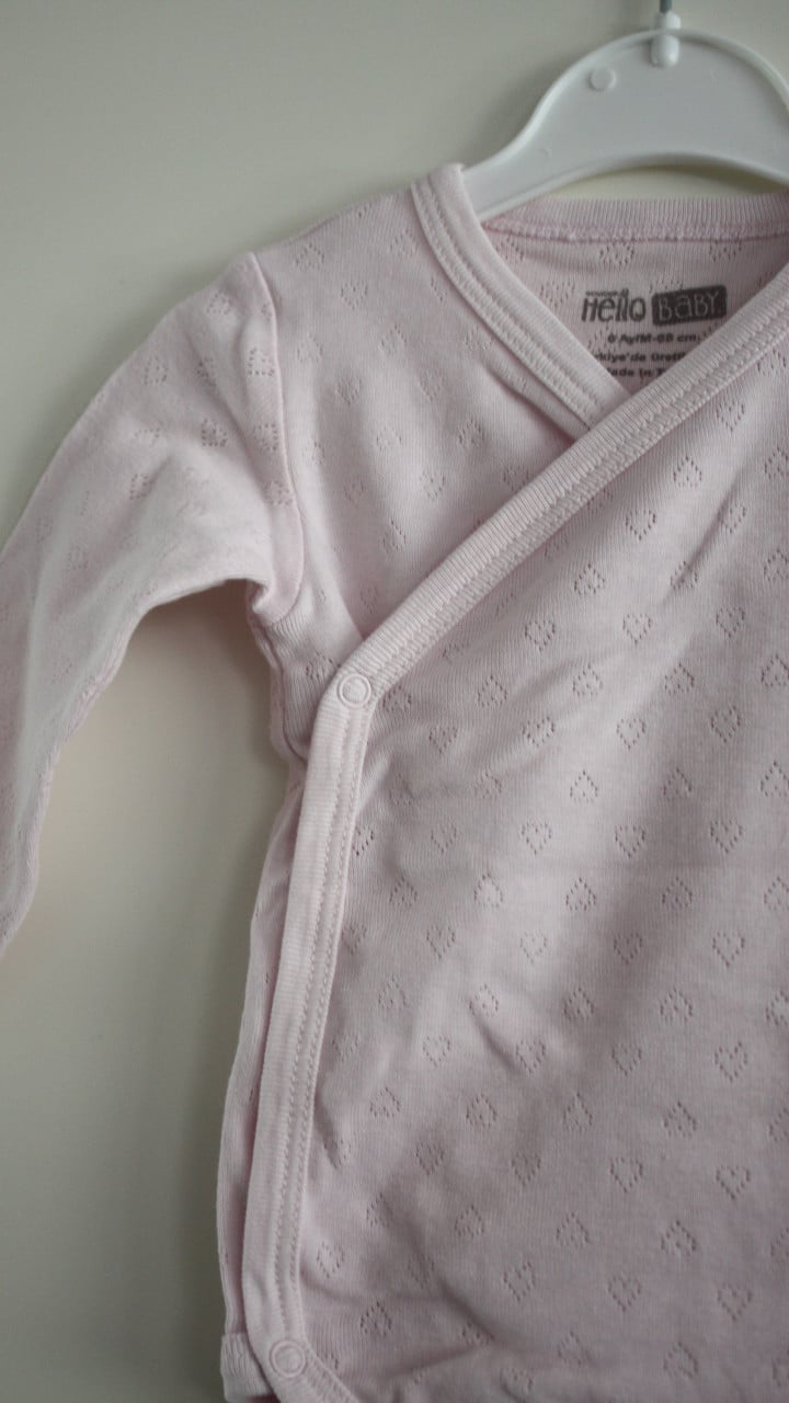 Roze romper maat 68