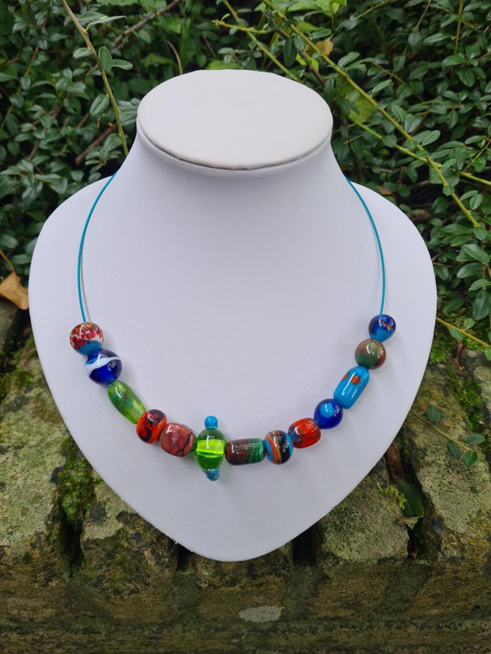 Glaskralen maken achter de brander